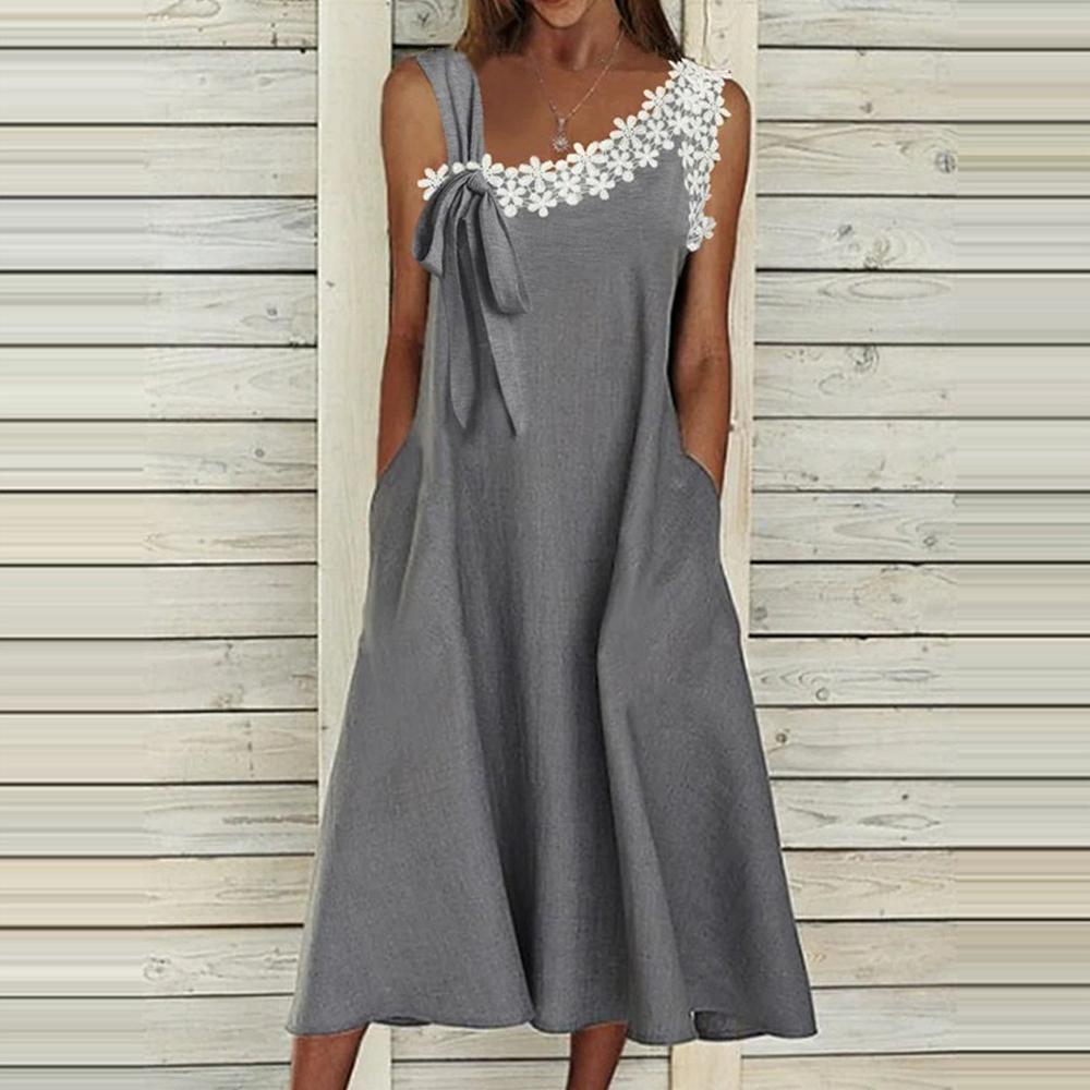 Vestido sin mangas de encaje guipur gris con apliques y cuello asimétrico