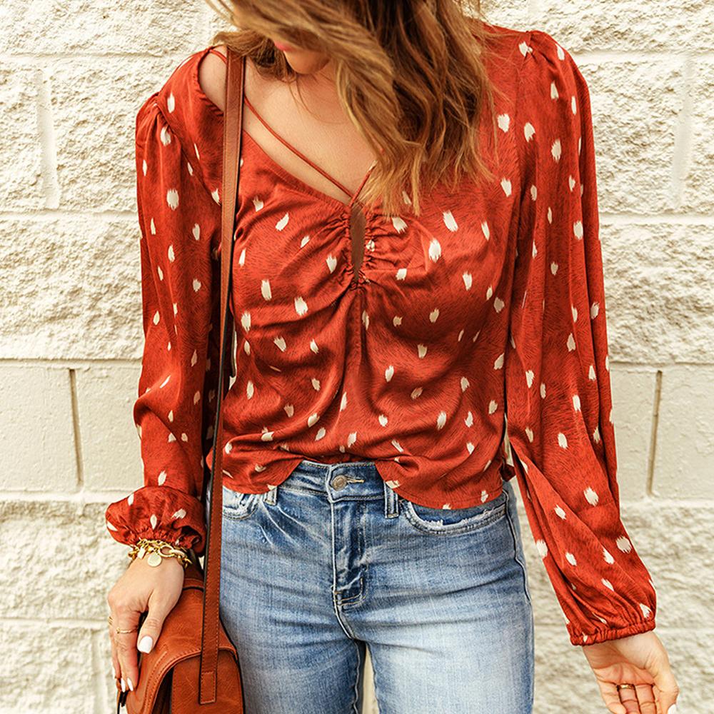 Blusa cruzada con manga farol y estampado de lunares
