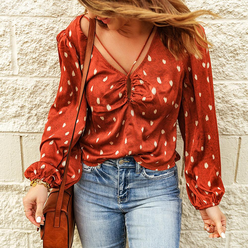 Blusa cruzada con manga farol y estampado de lunares